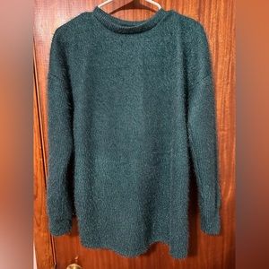Boutique teal sparkly sweater. Love the back detail. Never worn